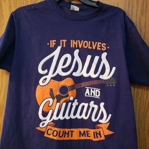 Men's blue t shirt with "If it involves Jesus and guitars count me in" on front